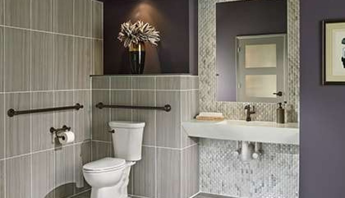 Modern bathroom with gray tiles and stylish decor.