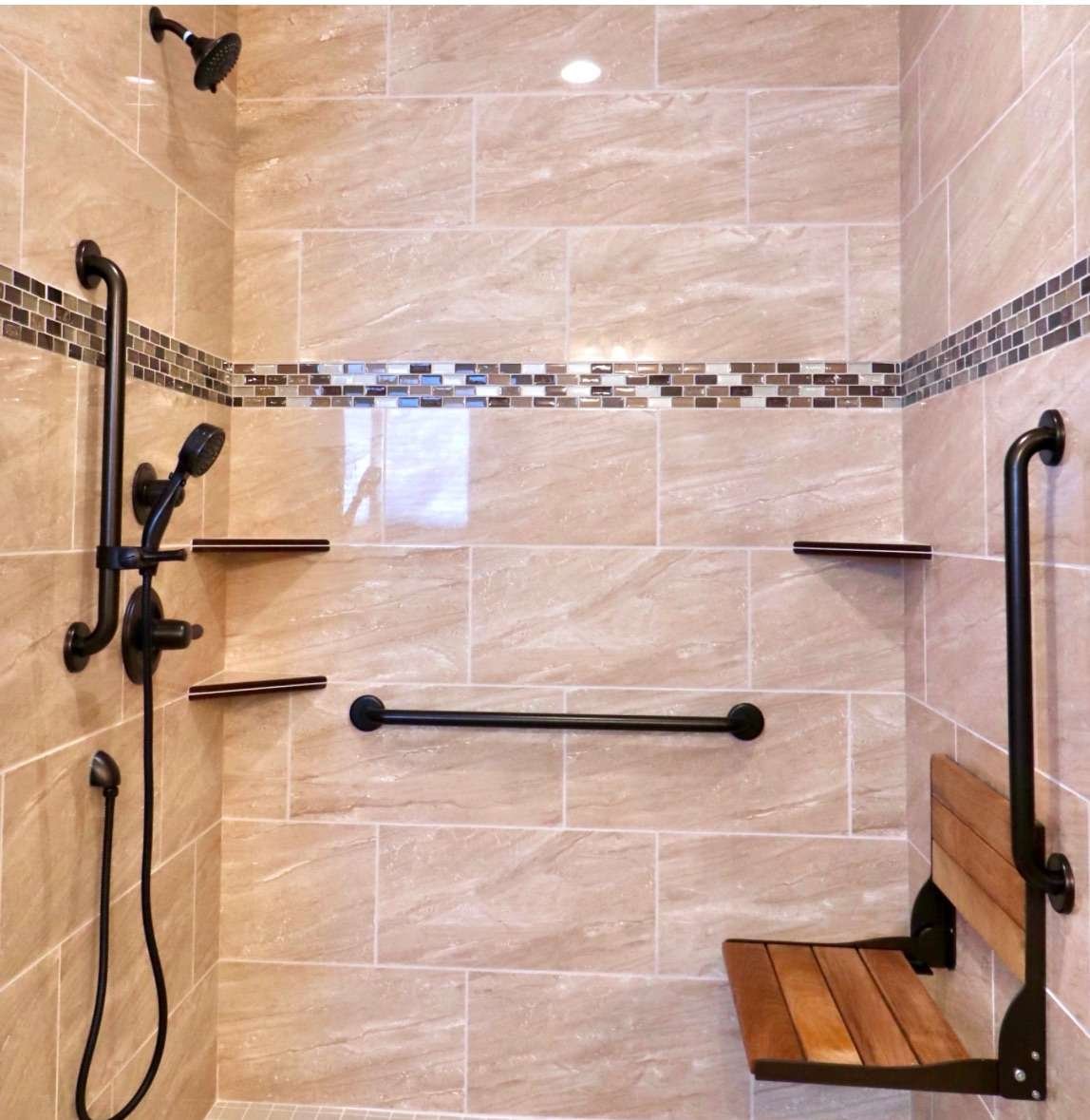 Accessible shower with grab bars and bench.