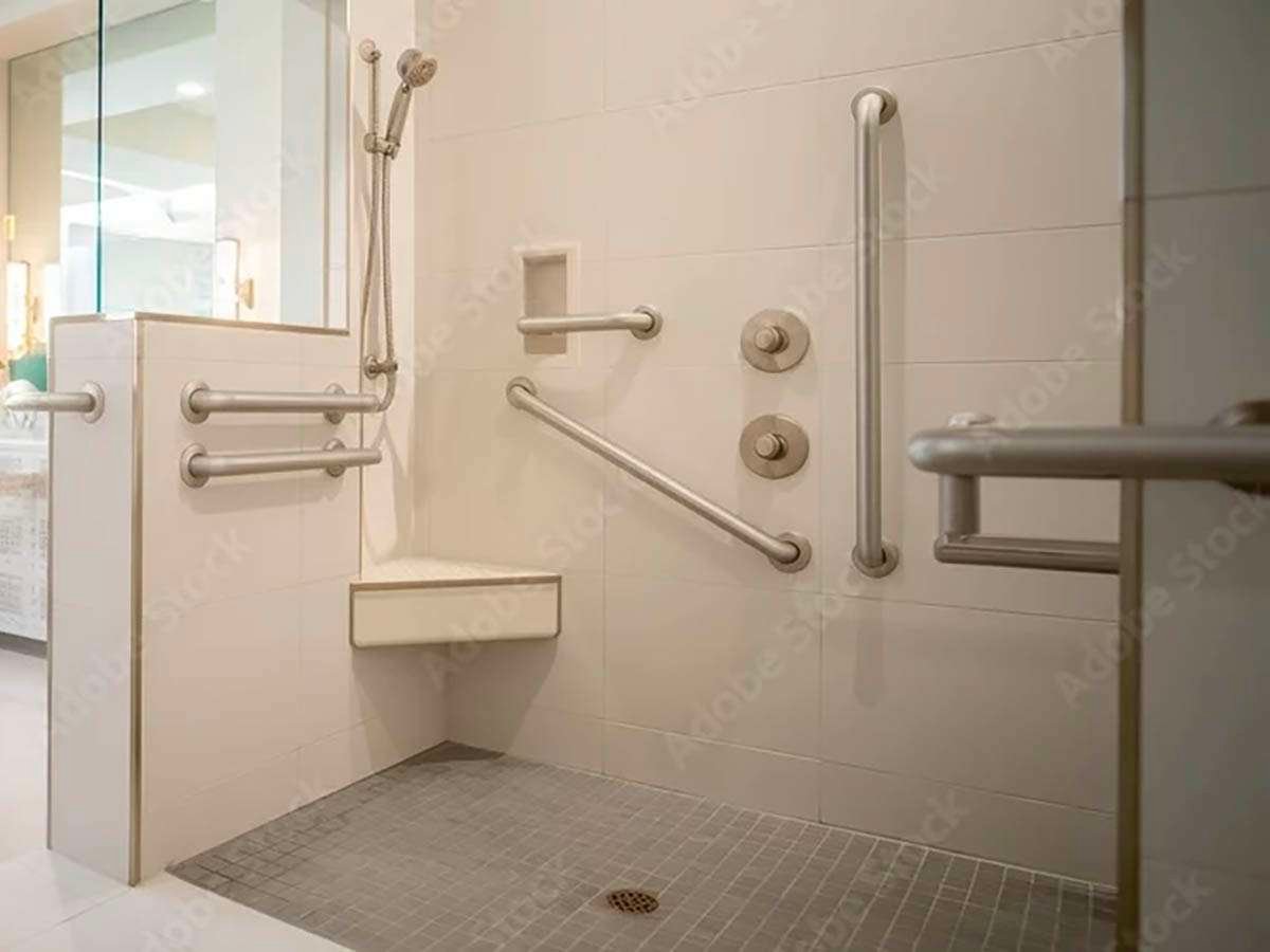 Accessible shower with grab bars and seating