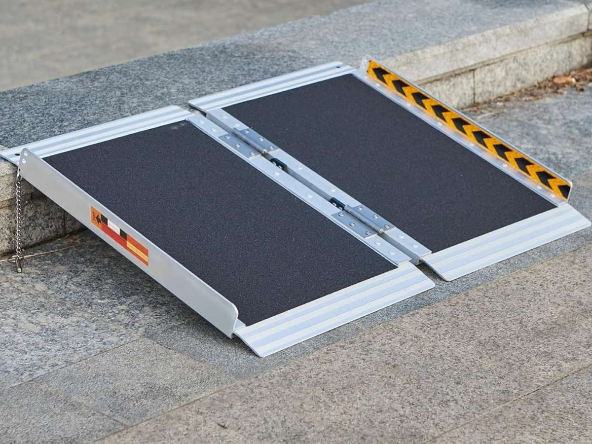 Portable ramp for wheelchair accessibility over steps.