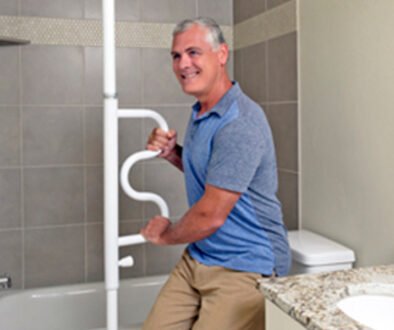 Man using safety grip inside bathroom