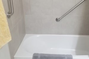 Accessible bathroom with tub and safety features