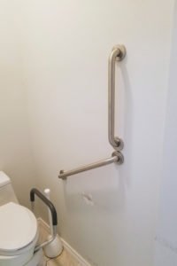 Two Hand Rails Installed Near Toilet