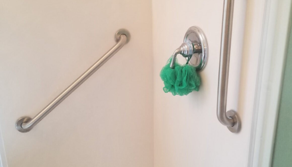 Shower with grab bars and a loofah